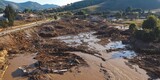Aerial photos showcasing the aftermath of debris flow, highlighting reconstruction and protection measures following flooding. Aerial photos capture the significant impact and recovery efforts.
