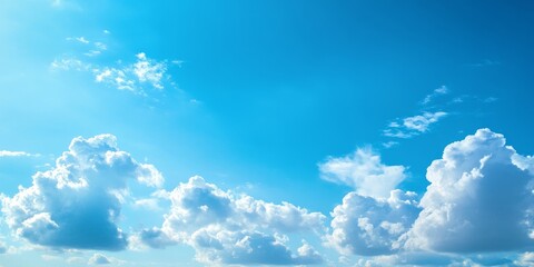 Poster - Vibrant summer blue sky with fluffy clouds creates a dreamy atmosphere, showcasing the beauty of a clear blue sky and the serenity that comes with a summer s day filled with blue sky.