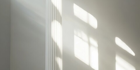 Aufkleber - A pillar set against a bright white backdrop, illuminated by sunlight. The column stands out prominently in the radiant light of the sun.