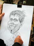  Cartoonist making a caricature of a man.