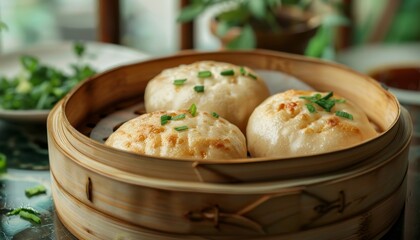 Sticker - Three steamed buns with green onions in a bamboo steamer.