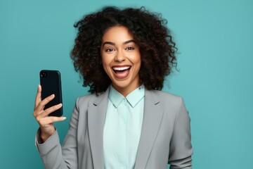 Poster - excited businesswoman showing smartphone app, enjoying online success, celebrating victory, isolated