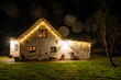 © Calado - Beautifully illuminated cosy traditional thatched roof house in Northern Germany at night