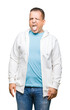 © Krakenimages.com - Middle age arab man wearing sweatshirt over isolated background sticking tongue out happy with funny expression. Emotion concept.