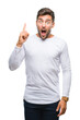 © Krakenimages.com - Young handsome man over isolated background pointing finger up with successful idea. Exited and happy. Number one.