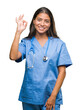 © Krakenimages.com - Young arab doctor surgeon woman over isolated background smiling positive doing ok sign with hand and fingers. Successful expression.