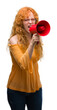 © Krakenimages.com - Young redhead woman holding megaphone annoyed and frustrated shouting with anger, crazy and yelling with raised hand, anger concept