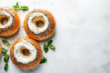 Sticker - Tasty fresh bagel with cream cheese on a white backdrop seen from above