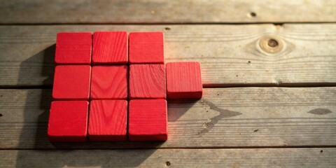 Aufkleber - Red Wooden Blocks Arranged on Rustic Wood Surface