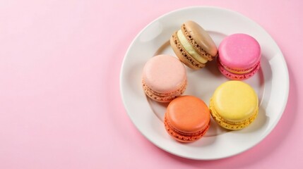 Poster - A delectable arrangement of pastel-colored macarons on a pristine white plate against a soft pink background