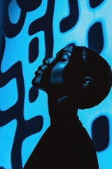 Poster - Silhouette of a Person Against Abstract Blue Pattern with Deep Shadows and Contrasts
