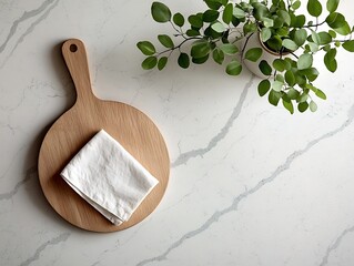 Poster - Overhead view of a minimalist marble kitchen countertop featuring a wooden board and crisp linen napkin in a bright airy and Nordic inspired setting