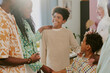 © AnnaStills - African American boy looking at his relatives and enjoying moment in family circle