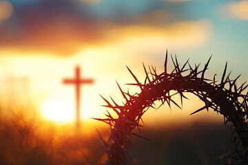 Wall Mural - crown of thorns of jesus christ against silhouette of catholic cross at sunset background
