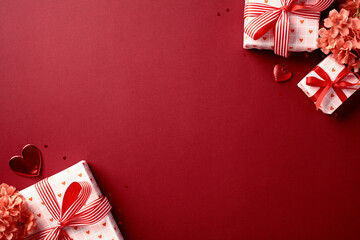 Wall Mural - Valentine's Day greeting card template. Banner design with festive gift boxes and flowers on red background.