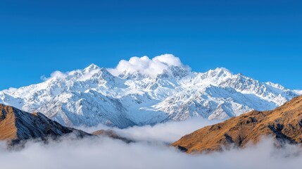 Poster - A panoramic view of snow capped mountains with clouds swirling around the peaks, creating a sense of awe inspiring beauty and grandeur.