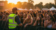 © Patrick - Security, crowd and party in concert, event or festival with guard for control. Safety, people and public with celebration at outdoor, music and evening for protection