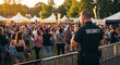 © Patrick - Security, crowd and party in concert, event or festival with guard for control. Safety, people and public with celebration at outdoor, music and evening for protection