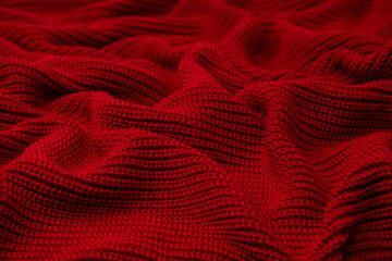 Wall Mural - Red sweater texture as a background.