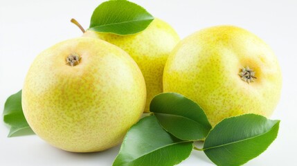 A beautifully shaped, plump pear rests gracefully on a soft surface, its rich yellow hue brightened by fresh green leaves. The setting reflects a serene, natural atmosphere, inviting admiration