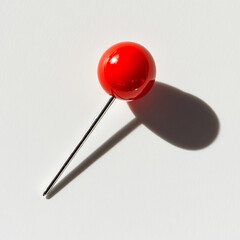 Poster - Minimalist red push pin casting a shadow on white surface