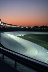Aufkleber - serene view of empty velodrome illuminated by soft lights with curves of track creating geometric beauty