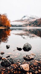 Poster - Serene Autumn Landscape with Mountainous Backdrop Reflecting in Calm Lake