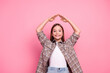 © deagreez - Cheerful young girl with playful expression posing against pink background