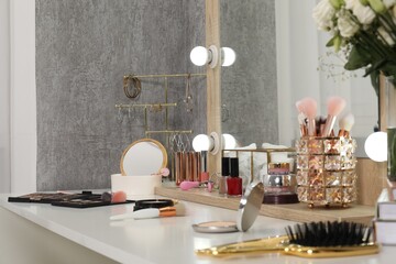 Wall Mural - Makeup room. Mirror, different beauty products and jewelry on dressing table indoors