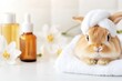 © Natalia - Small rabbit enjoying a spa day with towels, oils, and flowers for relaxation and comfort in a minimalist setting