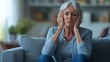 © Pixcellence - An Elderly Woman Experiencing Sadness and Emotional Distress