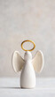 © Ruzana - Assumption of mary angel figurine with halo - vertical close up for religious decor