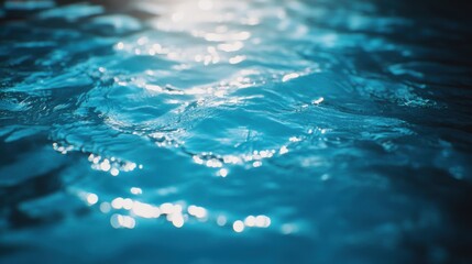 Poster - Sparkling blue water surface reflecting sunlight, creating a serene and tranquil atmosphere.