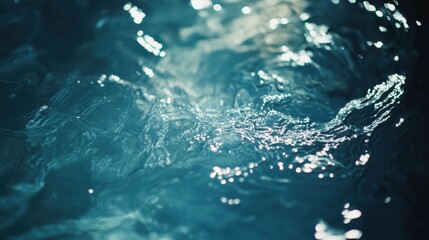 Poster - Close-up of sparkling blue water surface with gentle ripples reflecting light.