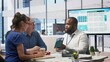 © DC Studio - Senior couple exploring retirement plans options with financial banker to increase their life savings and secure the future family expenses. Financial goals with agency adviser. Camera B.