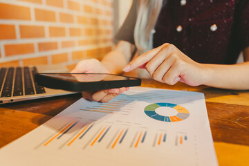 Poster - Businesswoman Analyzing Data on Smartphone with Charts and Graphs Displayed