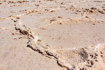 A desert landscape with a lot of sand and rocks