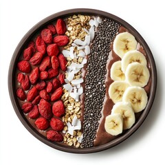 Chocolate smoothie bowl with goji berries, banana, chia seeds, oats, and coconut flakes.