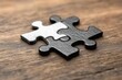 © 宜然 左 - Black and White Puzzle Piece on Wooden Surface, Concept of Balance and Harmony in a Minimalist Style