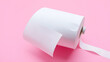 © Julie - White toilet paper roll on isolated pink background. Personal hygiene.