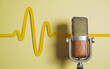 © Farhan - Microphone with yellow sound waves on yellow background. podcasting and audio recording work. mic with waves.