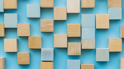 Wooden blocks arranged in a pattern on blue background