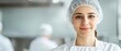 © pprothien - Professional food handler in hairnet and protective equipment. Food safety conceptual image.