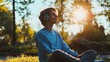 © irawan - Teenager enjoys peaceful music outdoors in sunlight