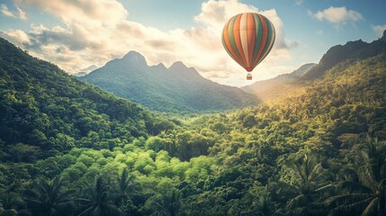 Wall Mural - A vibrant hot air balloon floats over a lush green landscape with mountains in the background.