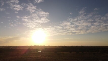 Wall Mural - sunset over a vast field