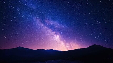 Wall Mural - milky way galaxy over silhouetted mountains at night