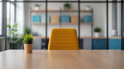 Poster - Small potted plant standing on a wooden desk with yellow chair and bookshelves in the background