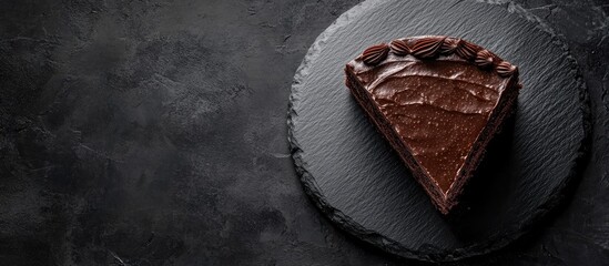 Aufkleber - Slice of chocolate cake presented on a black stone top view. with copy space image. Place for adding text or design