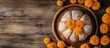 © vxnaghiyev - Pan de muerto a traditional pastry bread or bun topped with sugar and orange baked for Mexico s Day of the Dead Marigold flowers a symbol of death on a wooden background Copy space